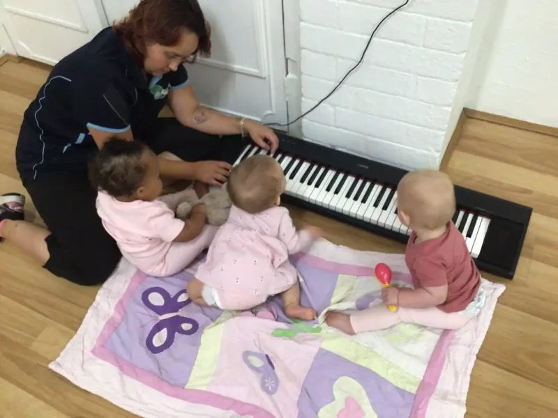 Babies experiencing early music education in the free enhancement program at Little Learners childcare centre White Gum Valley WA