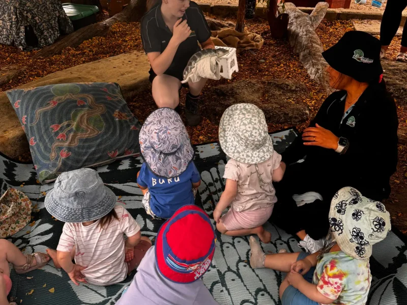 Toddlers sitting attentively as a wildlife handler introduces a native bobtail lizard during a wildlife incursion at Little Learners early learning centre White Gum Valley Perth